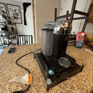 Sleek Black and Silver Coffee Machine